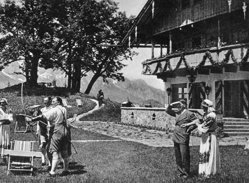 Hermann Göring makes an archery demonstration in front of his Obersalzberg house during Adolf Hitler's visit